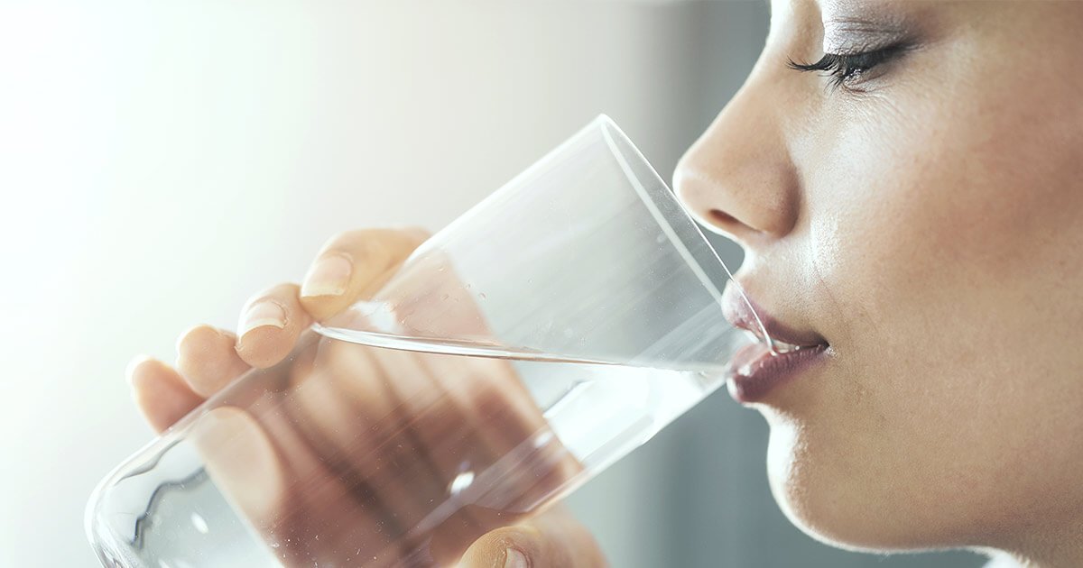 Woman drinking a glass of water